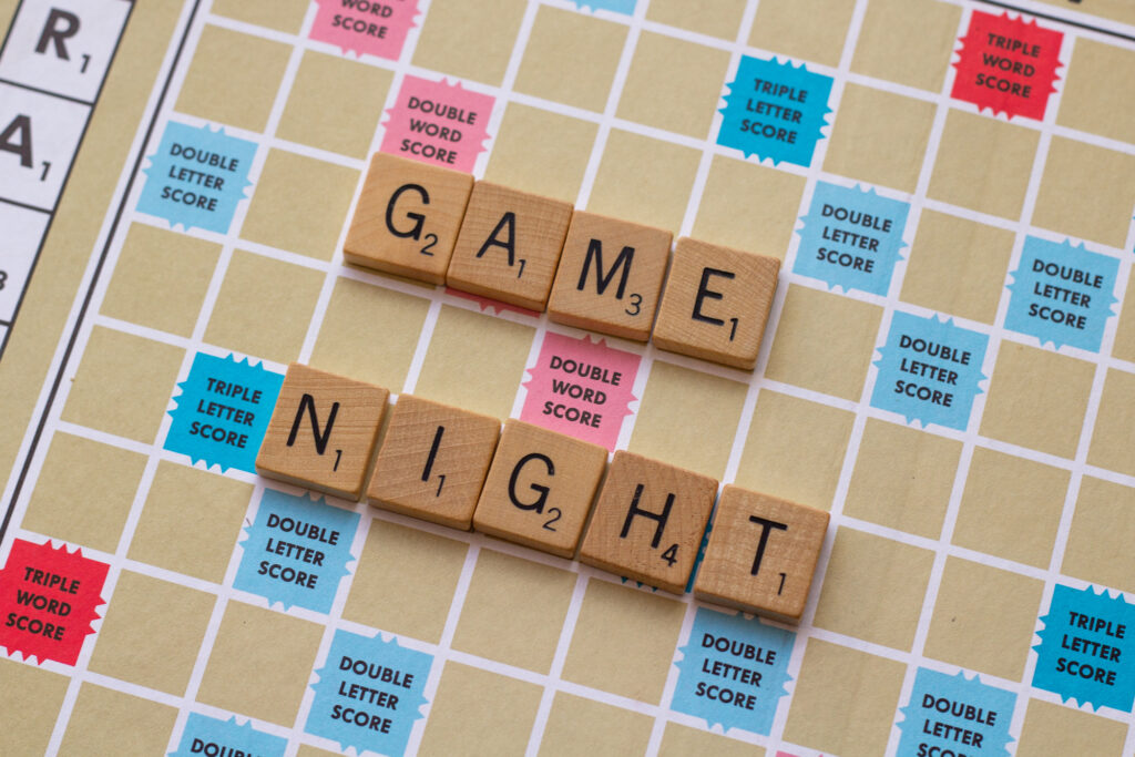 Scrabble board with the words Game Night spelled out in tiles - Fun Family Game Night